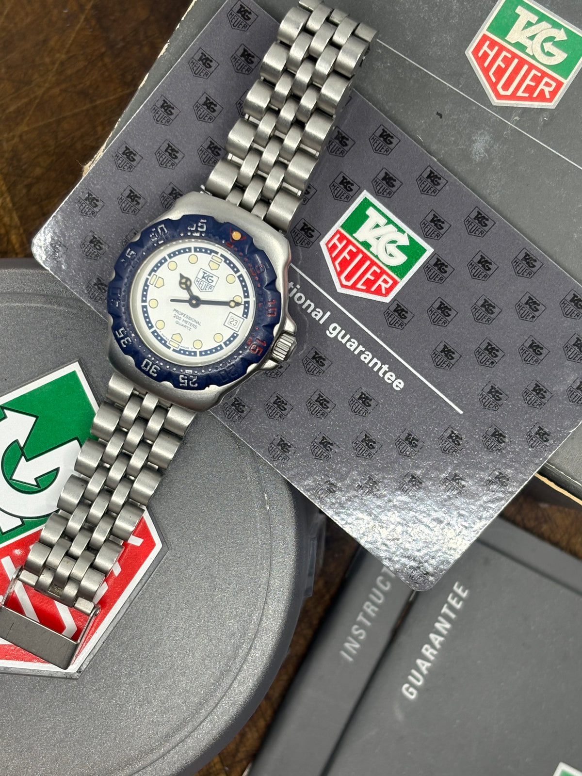 Vintage TAG Heuer Ladies Professional 200M Quartz Watch | White Dial Blue Bezel Steel Bracelet