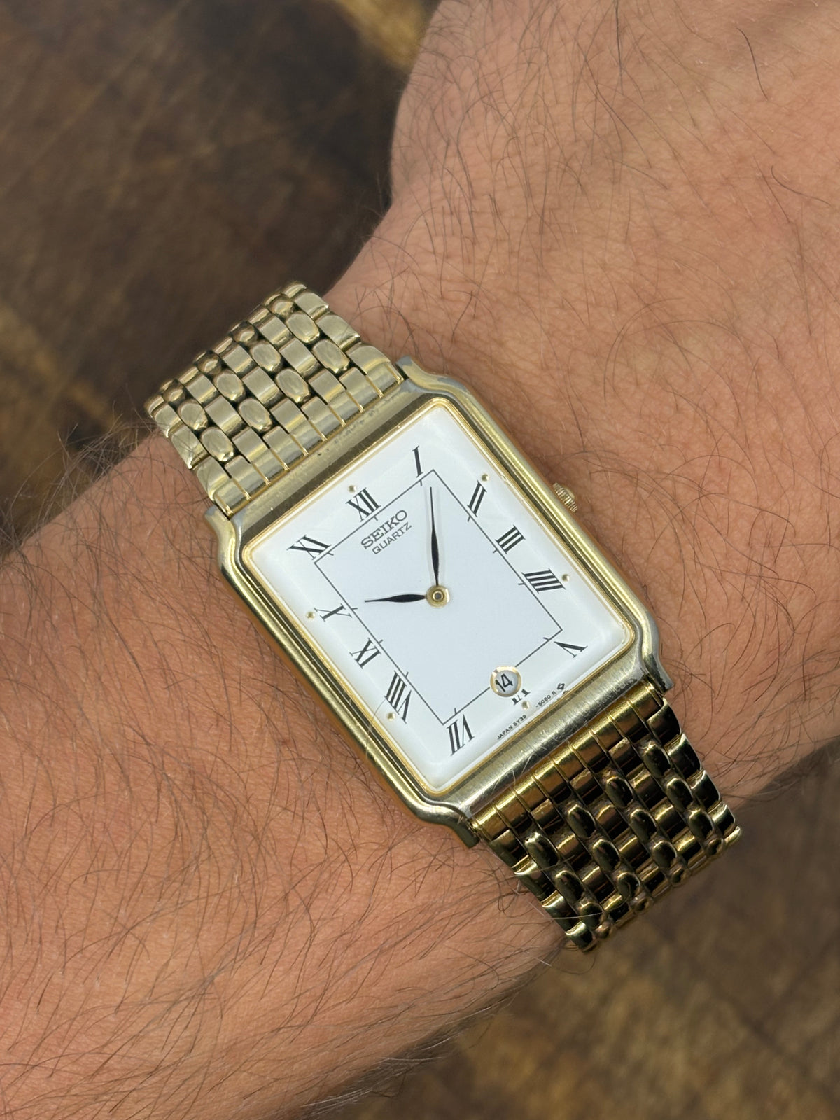 Seiko Quartz Rectangular Gold-Tone Dress Watch – White Roman Numeral Dial & Date