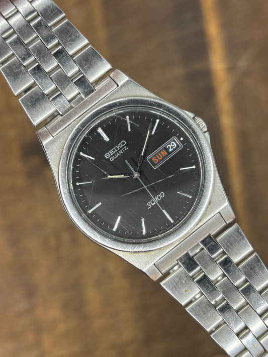 Seiko SQ100 Quartz | Black Dial | Day-Date | Stainless Steel | 1980s Vintage