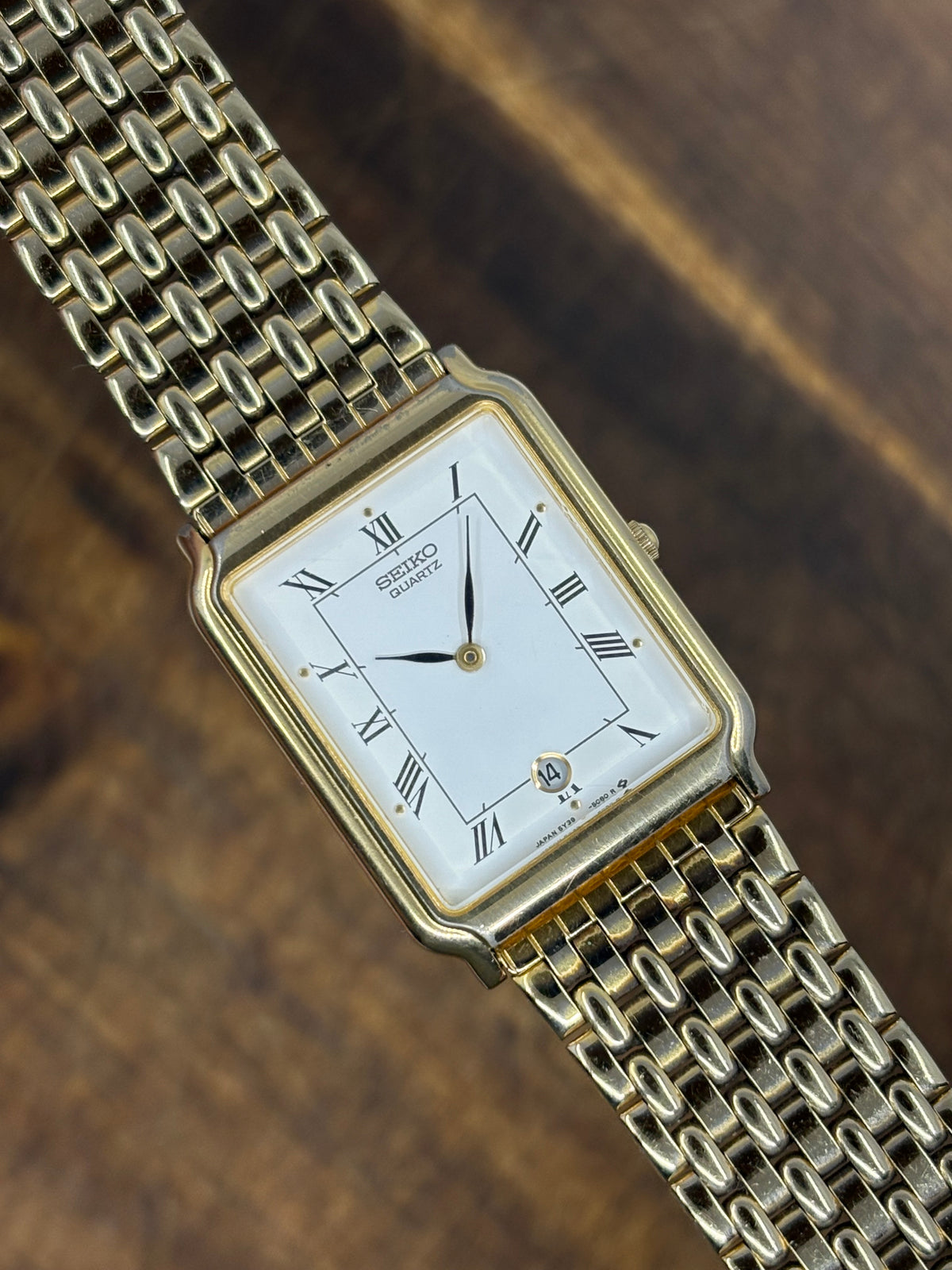 Seiko Quartz Rectangular Gold-Tone Dress Watch – White Roman Numeral Dial & Date