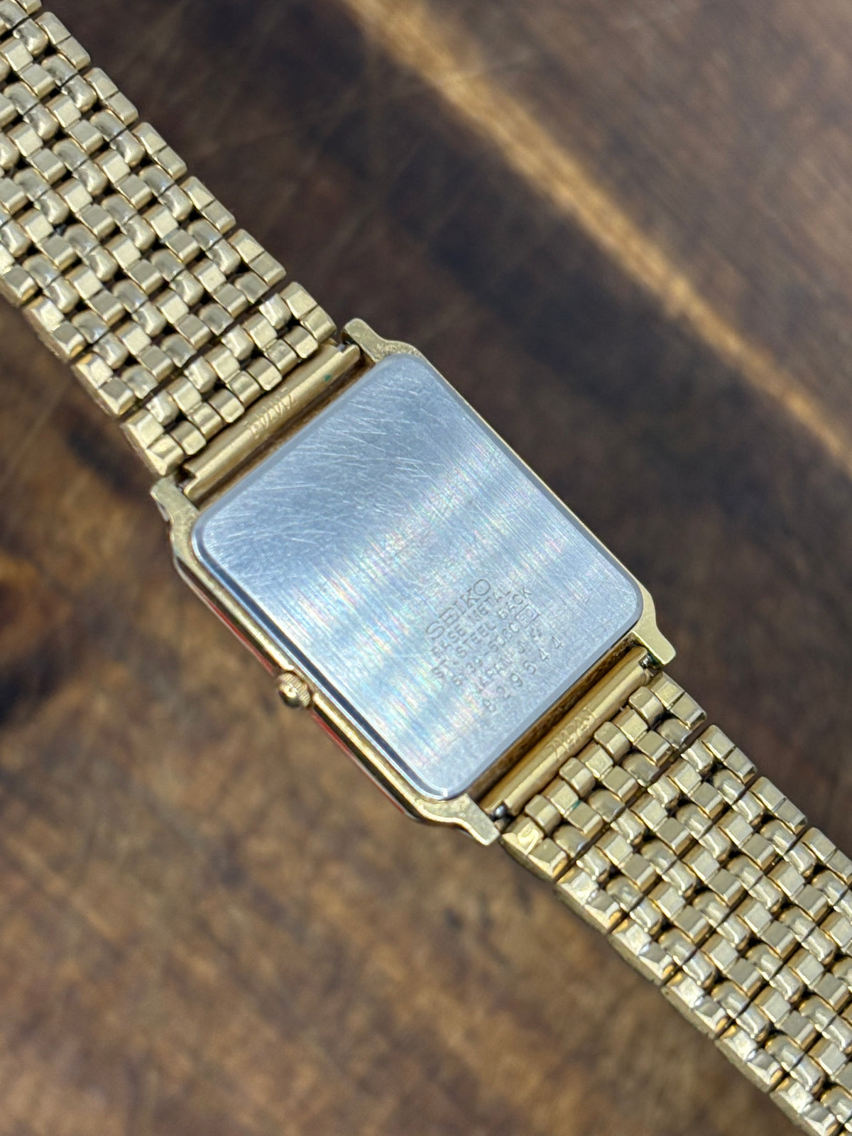 Seiko Quartz Rectangular Gold-Tone Dress Watch – White Roman Numeral Dial & Date