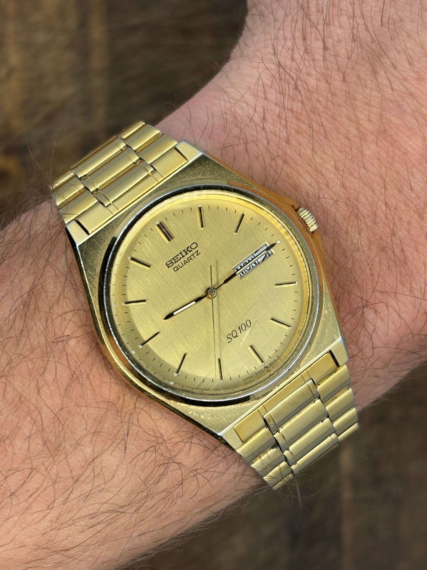 Seiko SQ100 Day-Date – Gold Dial & Bracelet
