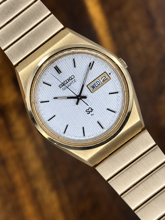 Vintage Seiko SQ Quartz Watch | Gold Tone White Textured Dial Day Date