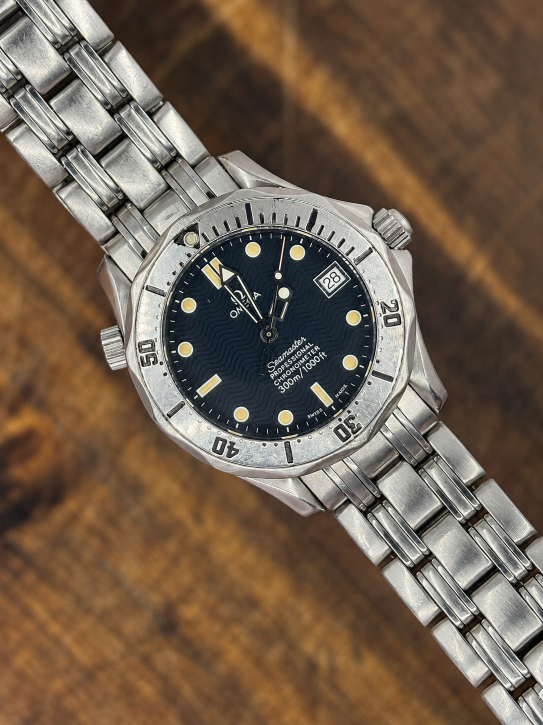 Vintage Omega Seamaster Professional Chronometer 300m watch with blue wave dial and stainless steel bracelet