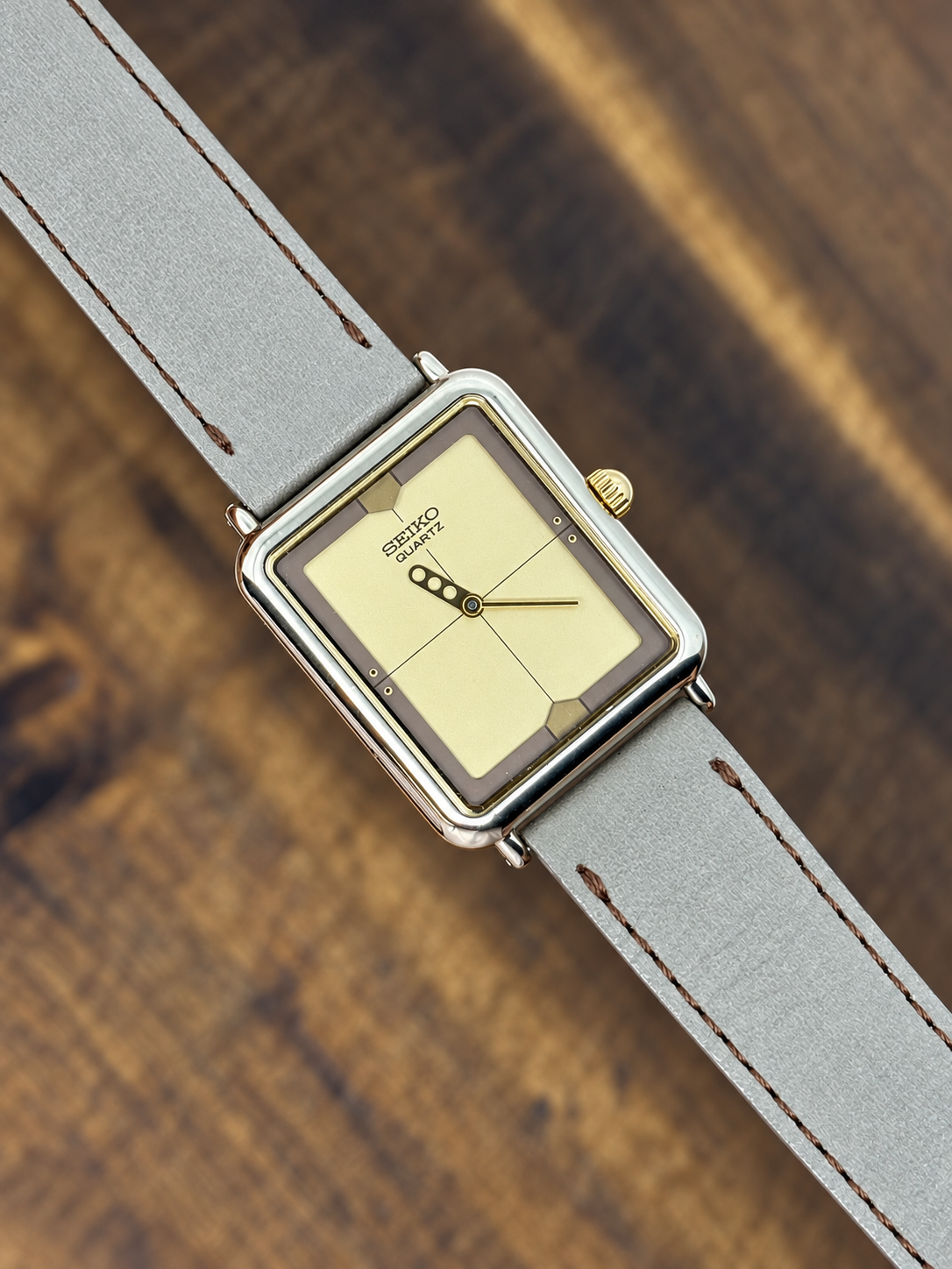 Vintage Seiko Quartz Rectangular watch with champagne dial, two-tone case and grey leather strap